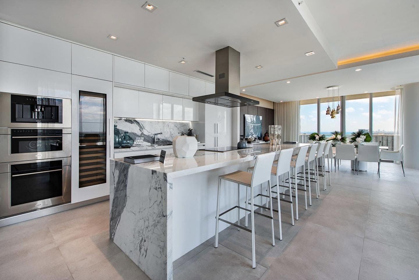 Modern kitchen with marble island and ocean views