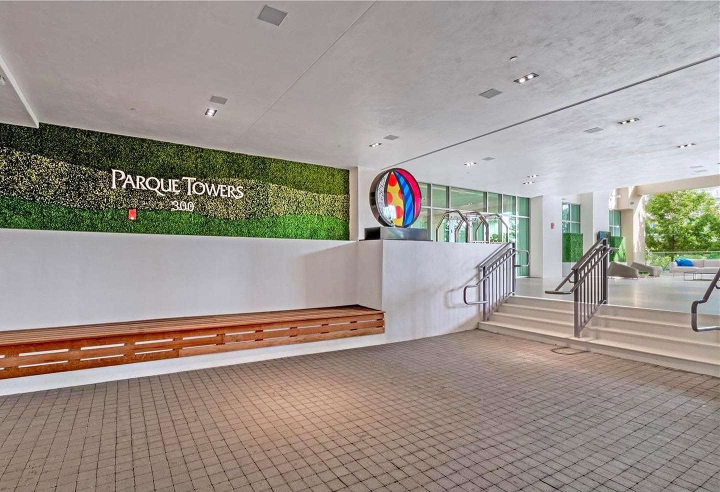 Parque Towers 300 lobby with living wall signage