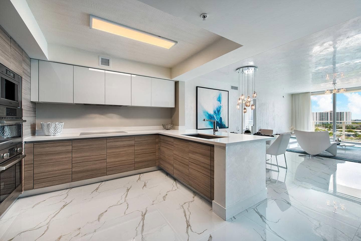 Open-concept kitchen and living area with balcony views